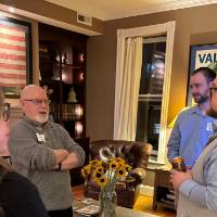 DC alumni talking at the event.